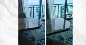 two marble tables in a sea facing balcony.